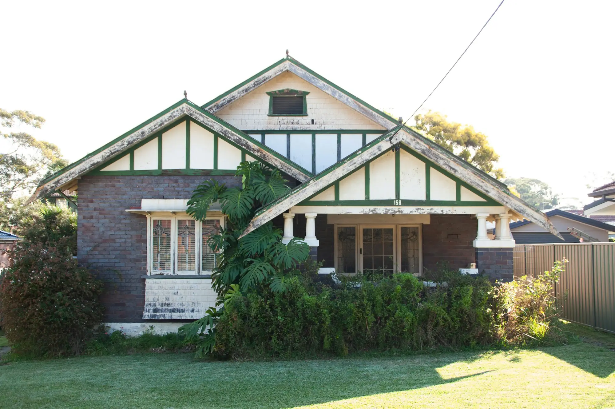 Federation-style brick home with a front garden in suburban Sydney
